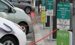 Electric cars being charged at station.