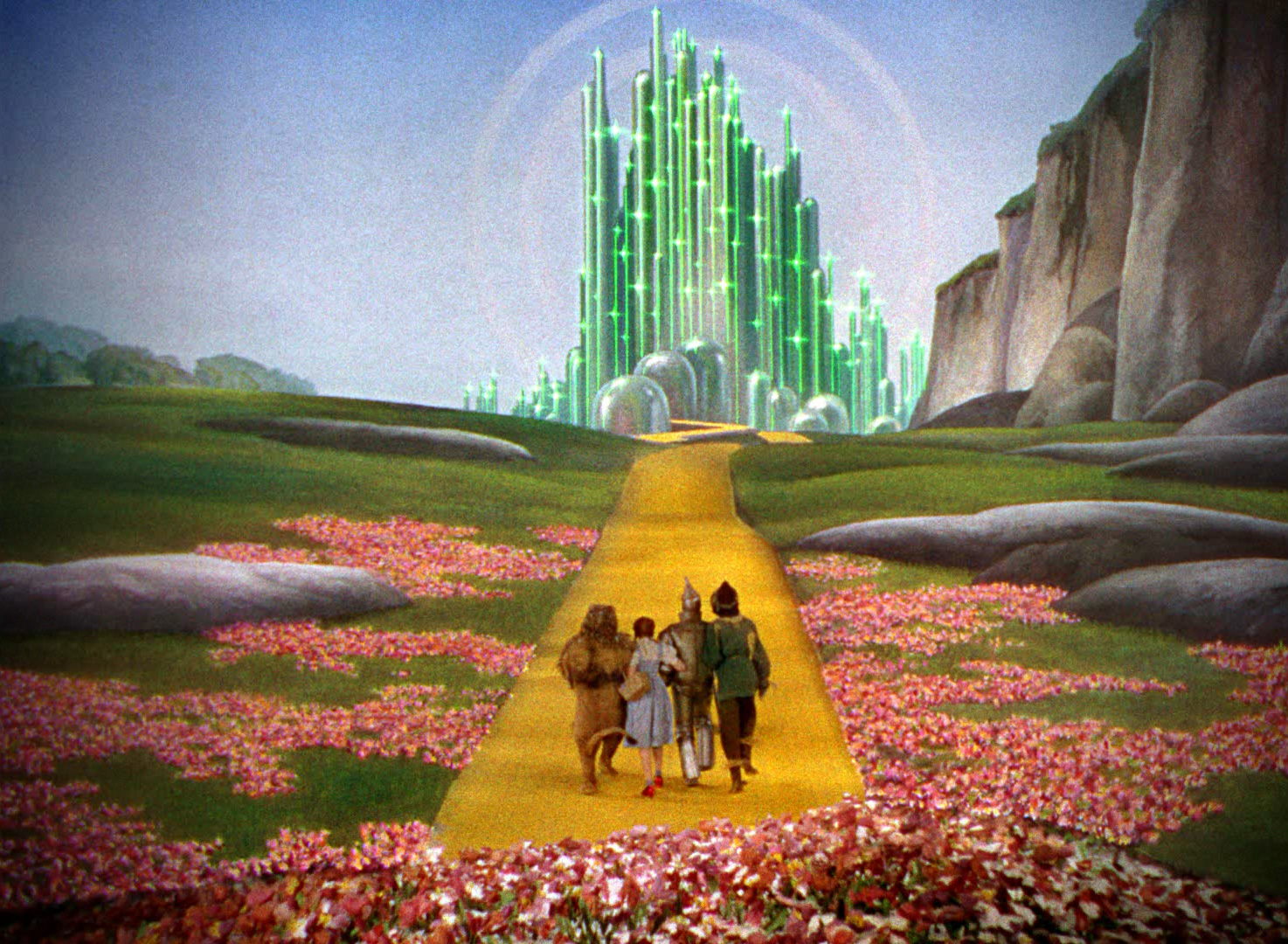 The characters of The Wizard of Oz walking down the yellow brick road.