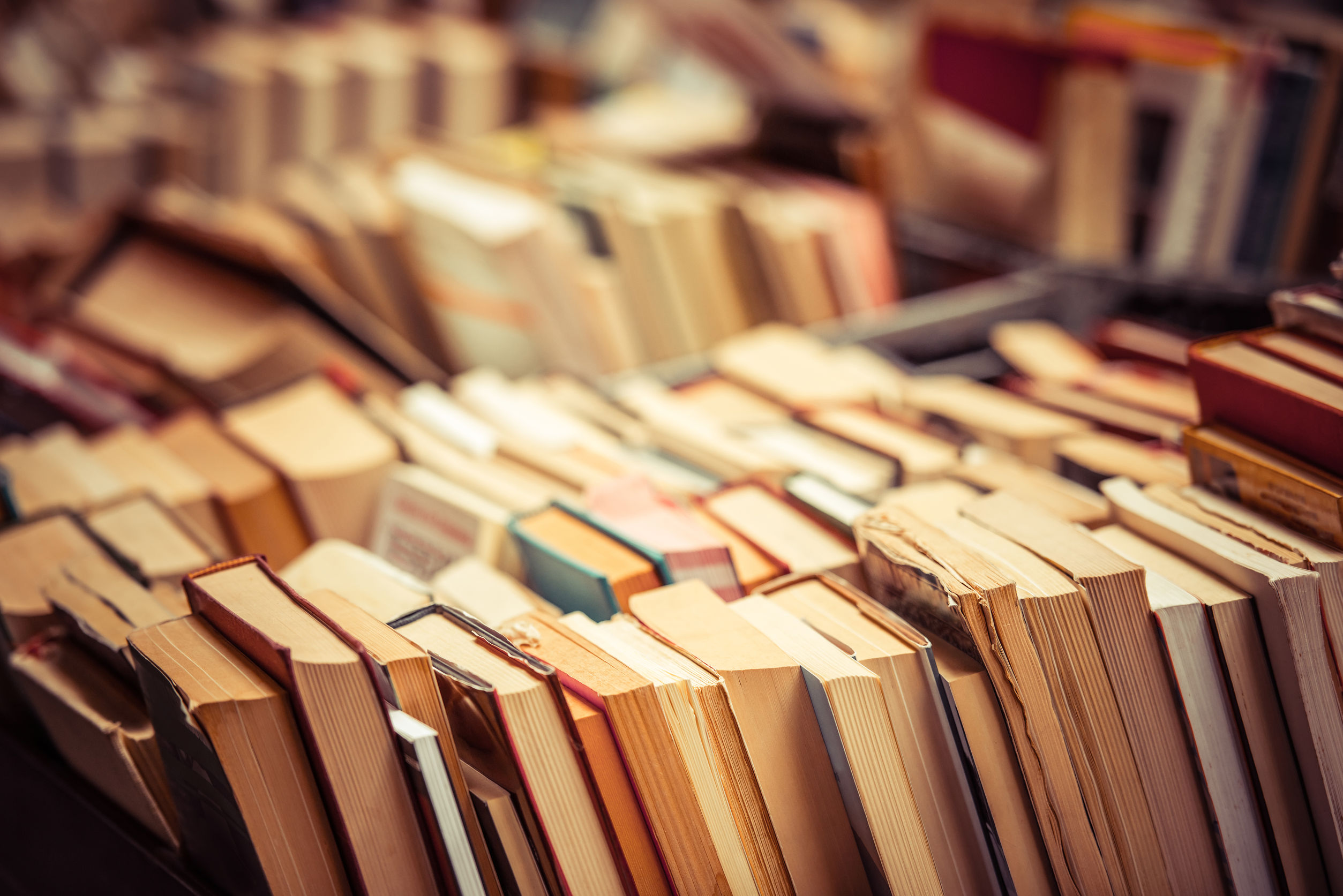 many old books in a book shop or library