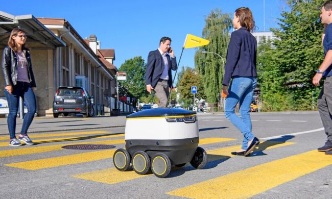 A Starship robot making a delivery.