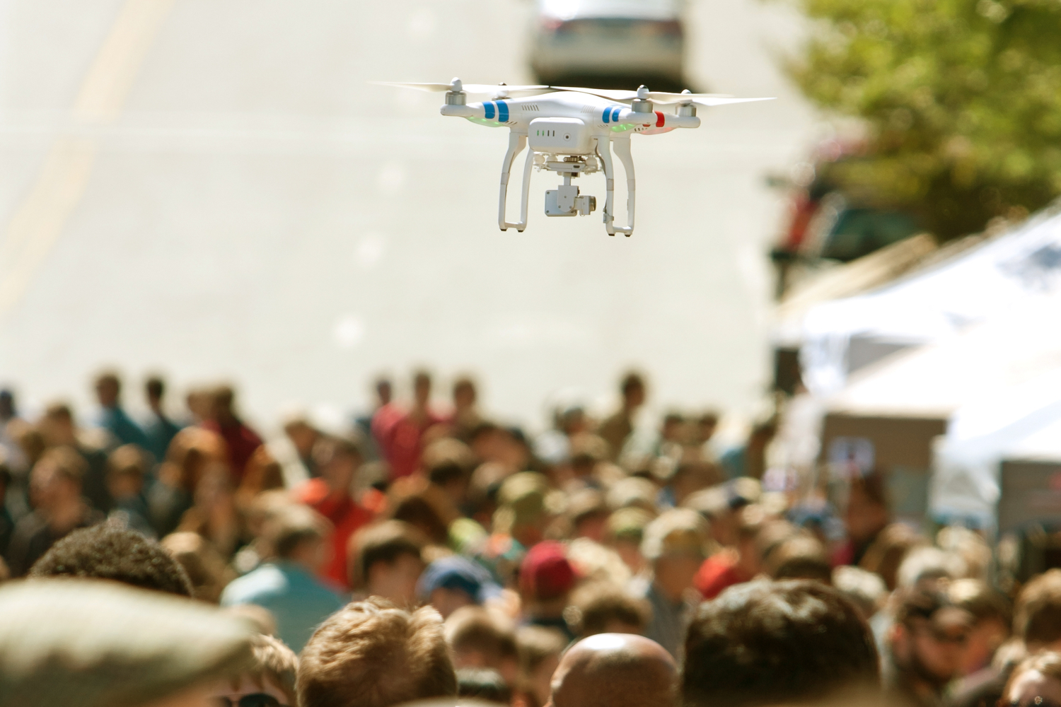 flock drone safety flying hovers over crowd at fair