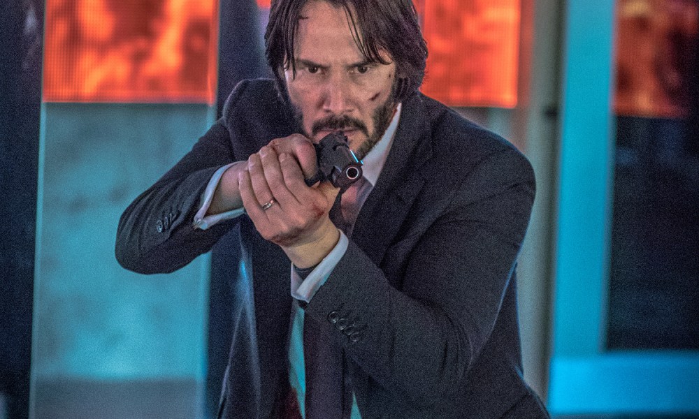 A man aims a gun in John Wick 2.