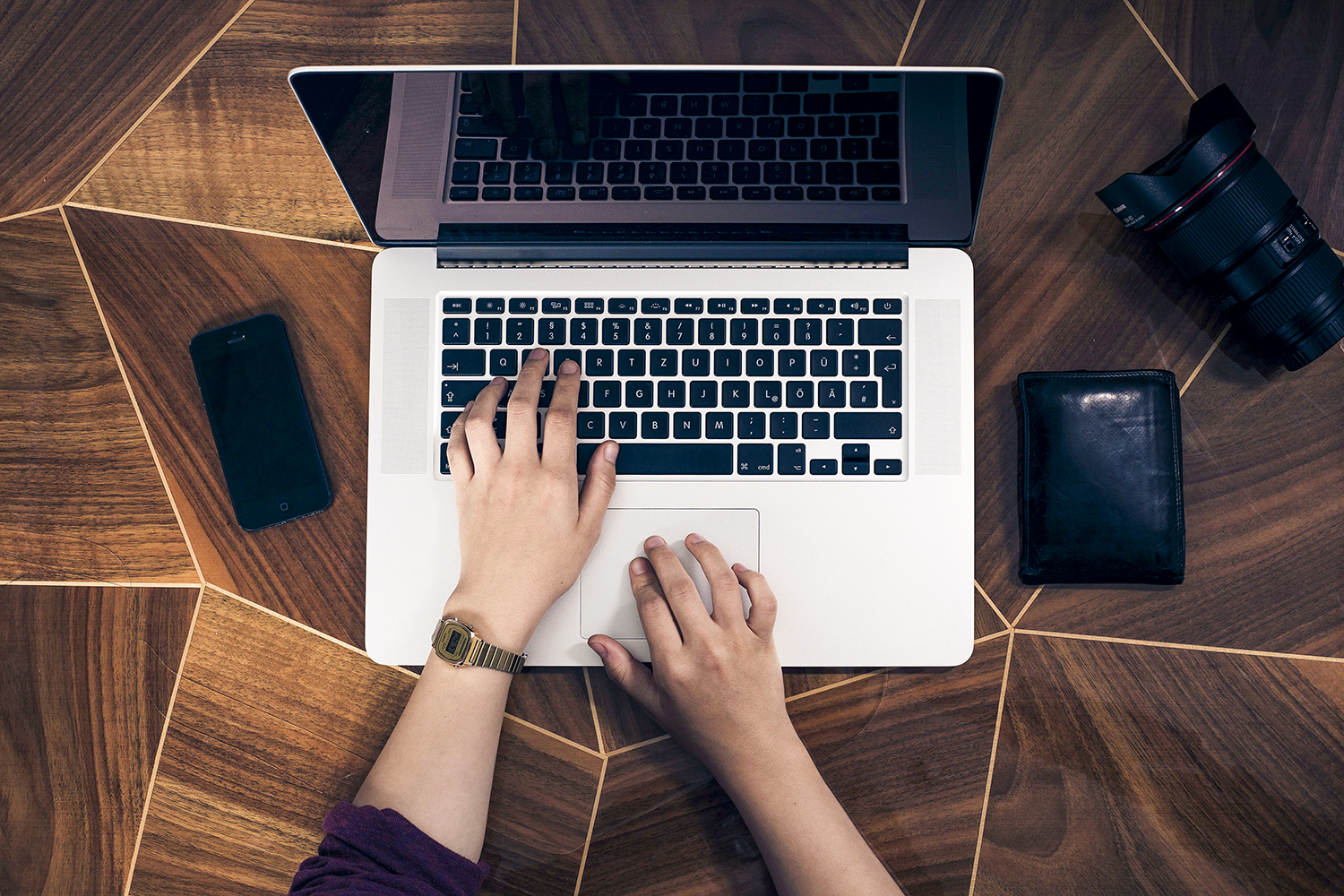 Typing on a MacBook.