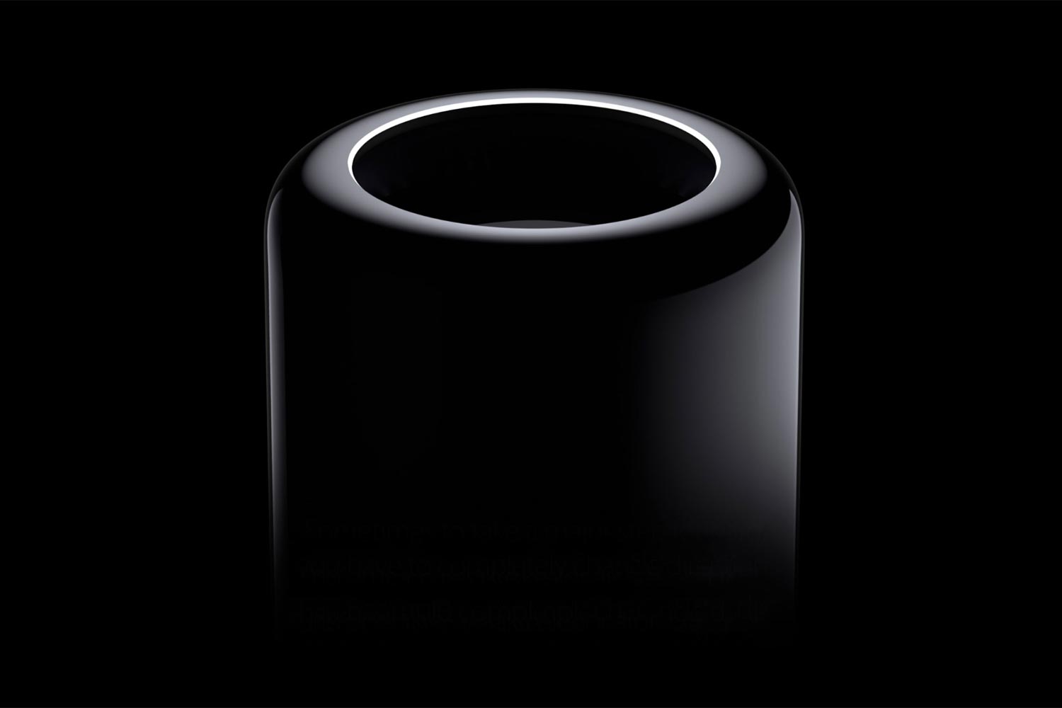 A 2013 Mac Pro is shown emerging out of a shadowy black background.