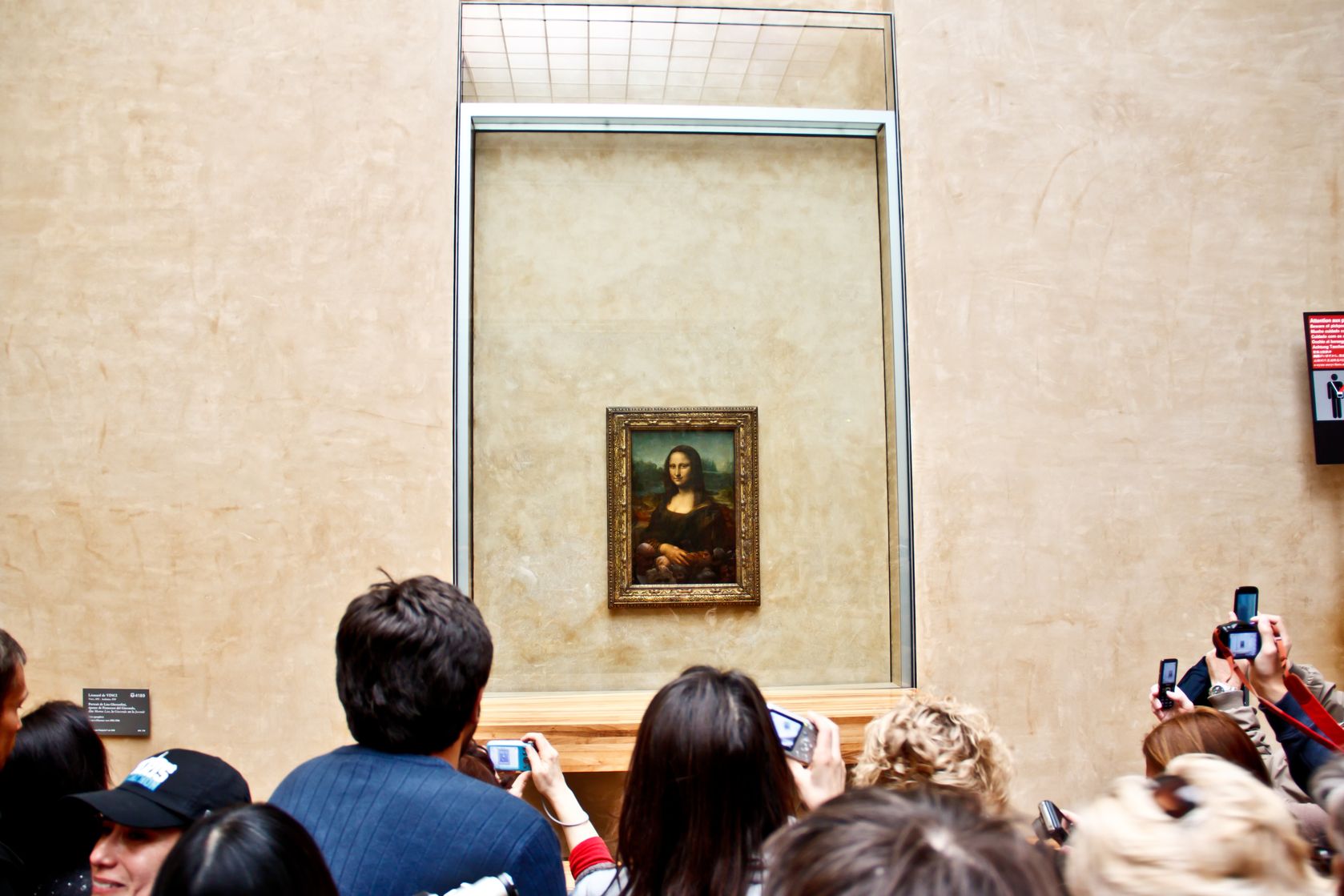 taking pictures improves visual memory 13413625  visitors take photo of the famous painting mona lisa