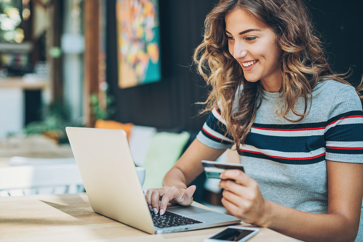 Woman shopping online for best Early Prime Day Deals