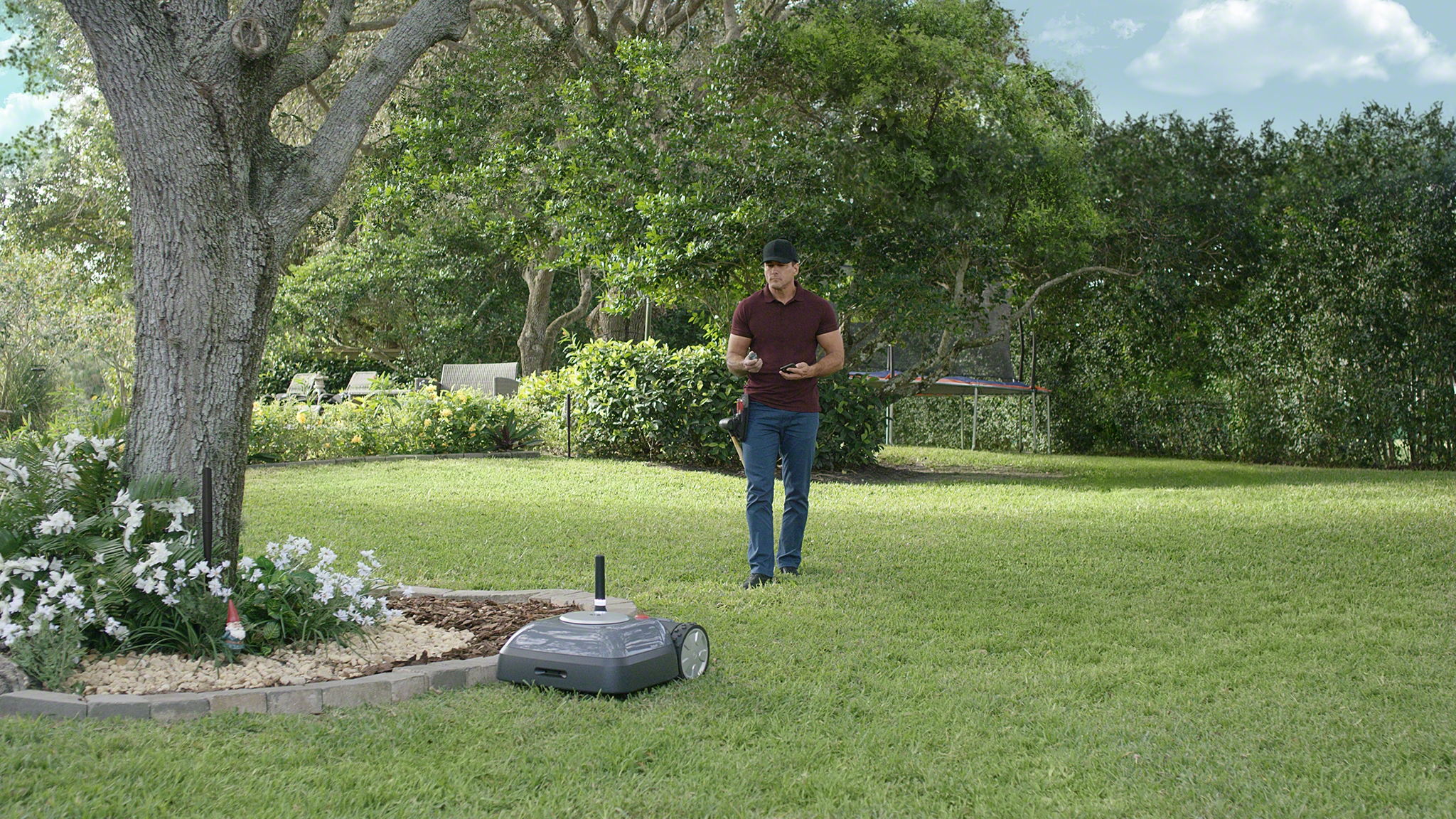 irobot terra robot mower photo lifestyle setup