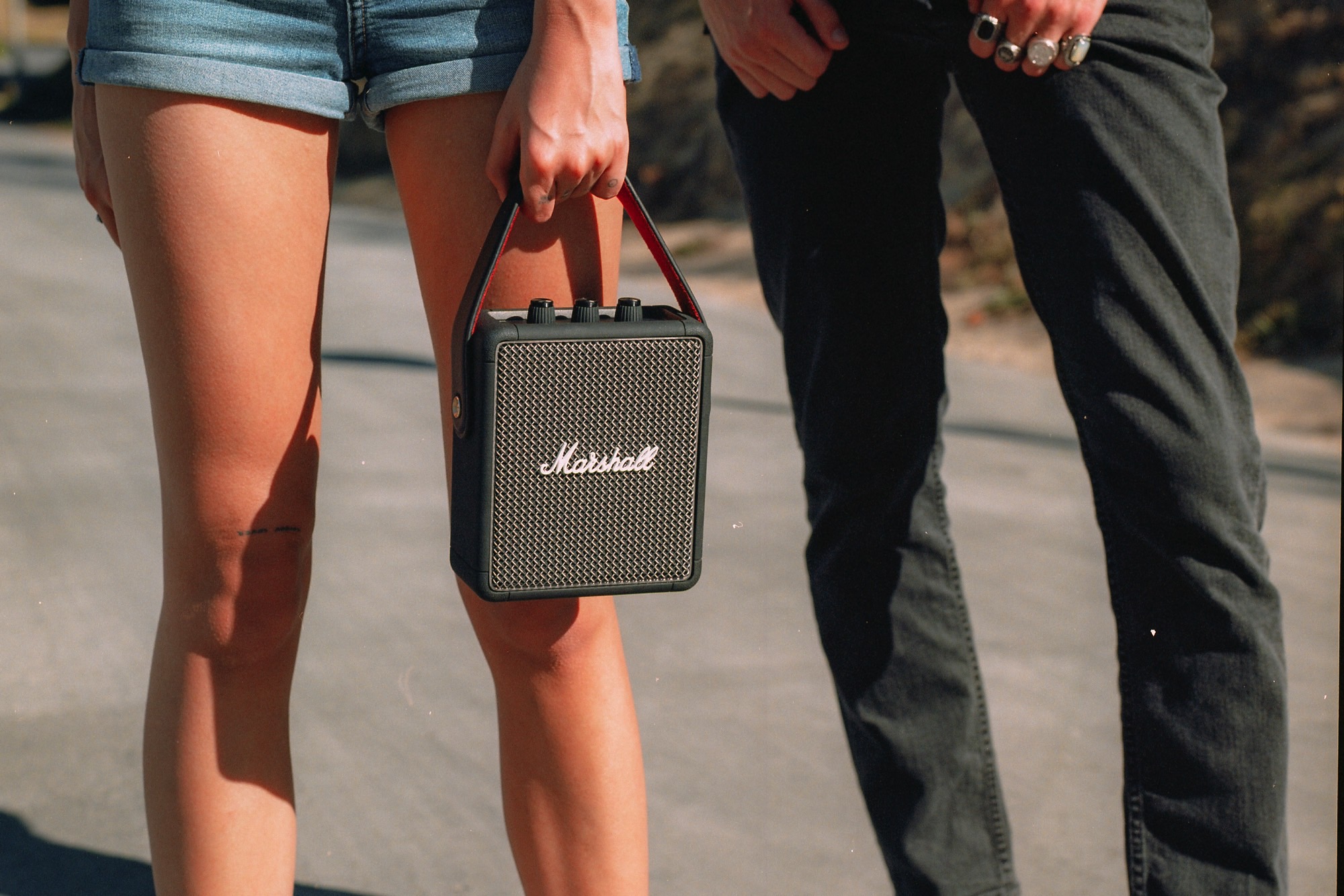 Carrying the Marshall Stockwell II portable Bluetooth speaker at an event.