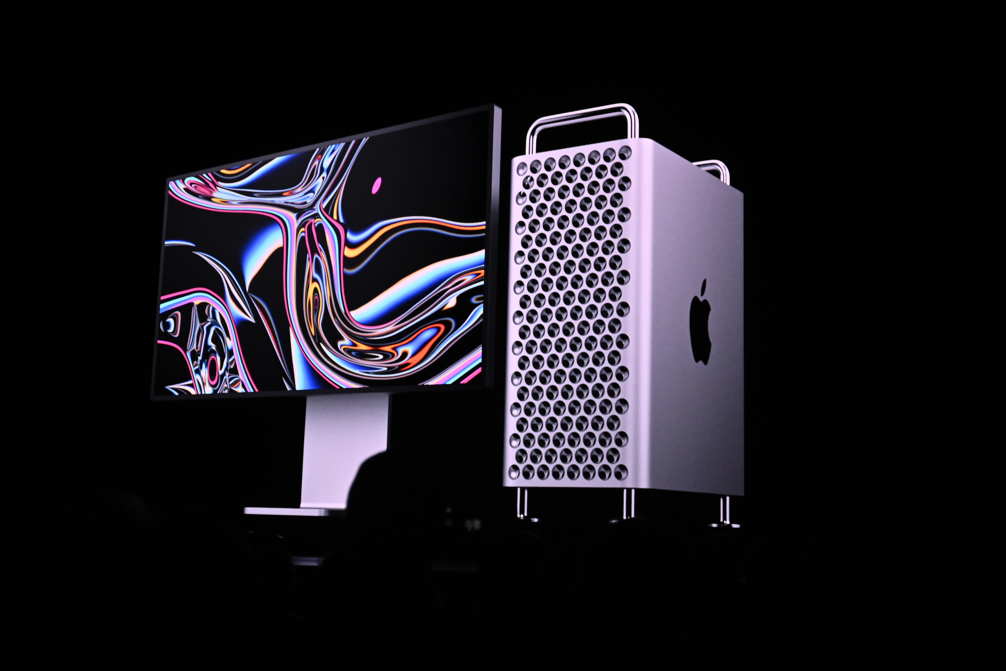 Screen at WWDC 2019 showing Mac Pro with audience watching.