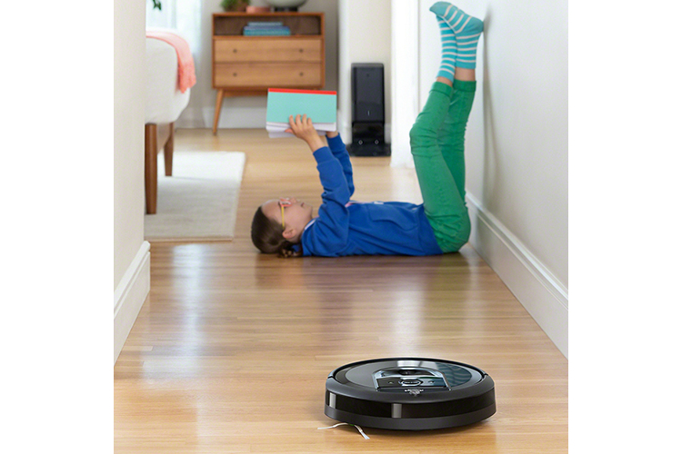 irobot slashes 150 off i7 best roomba robot vacuum that empties itself  charcoal cleanbase photo lifestyle girl hallway