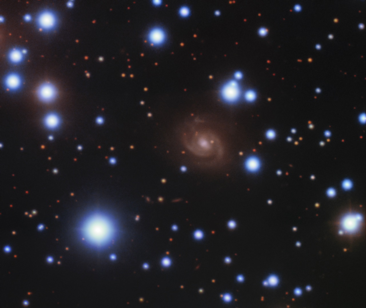 Image of the host galaxy of FRB 180916 (center) acquired with the 8-meter Gemini-North telescope of NSF’s OIR Lab on Hawaii’s Maunakea.