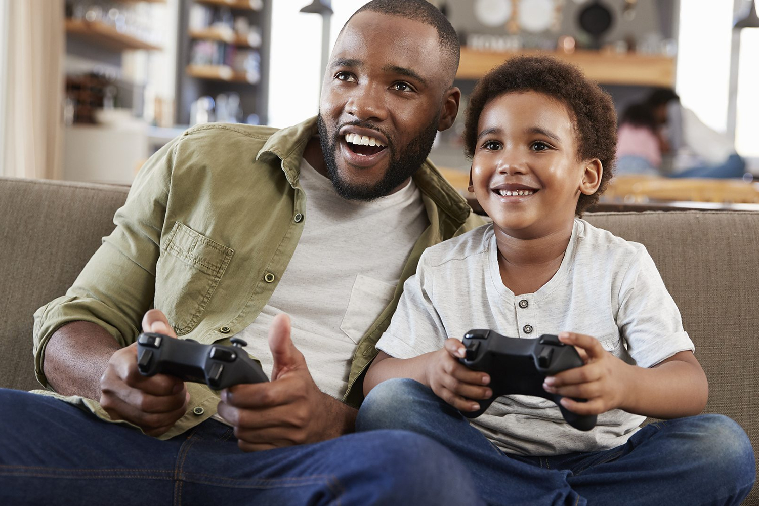 father and son playing video games