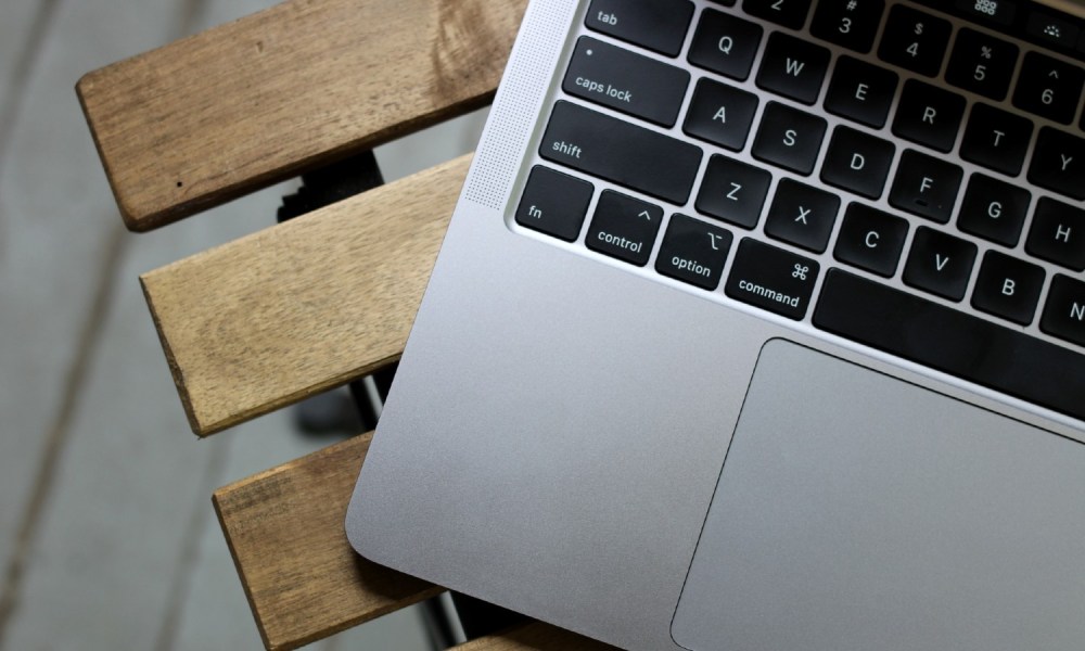 A MacBook Pro 13-inch on a table.