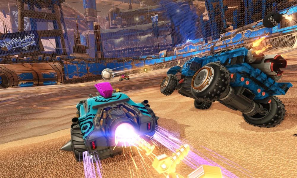 Rocket League players speeding towards the ball.