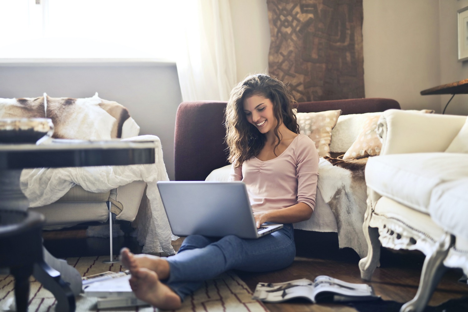 how to enable cookies woman smiling while using laptop 3769717