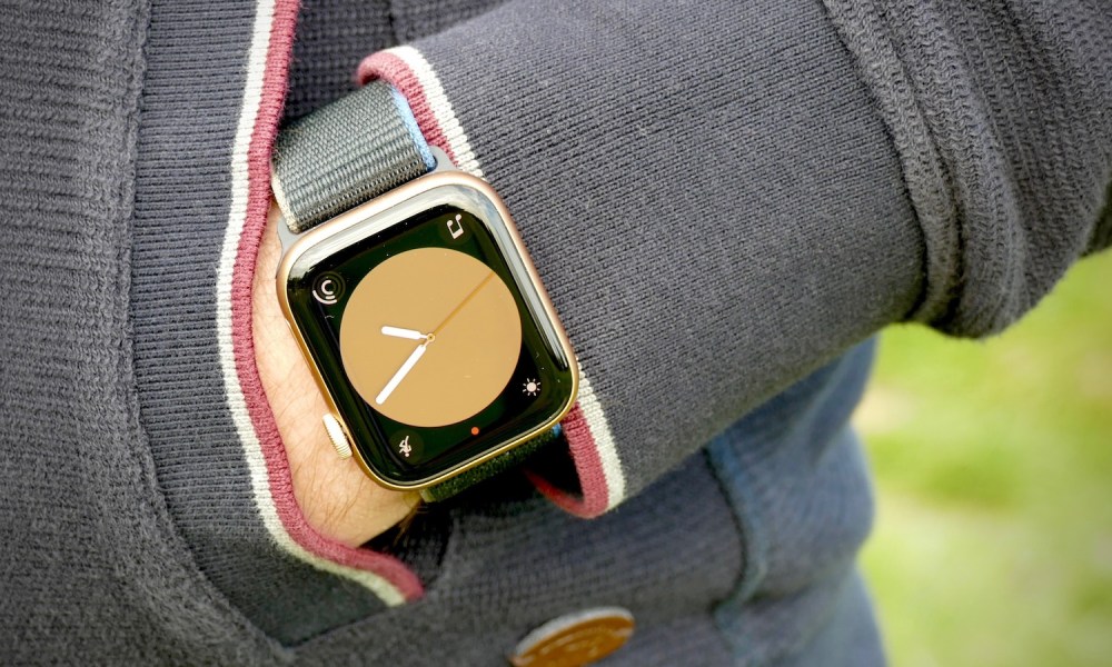 Apple Watch SE being worn on a wrist while the person's hand is in their pocket.