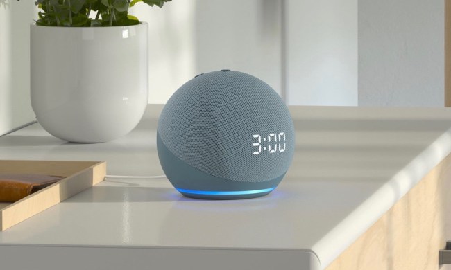 Echo Dot with clock on a counter.