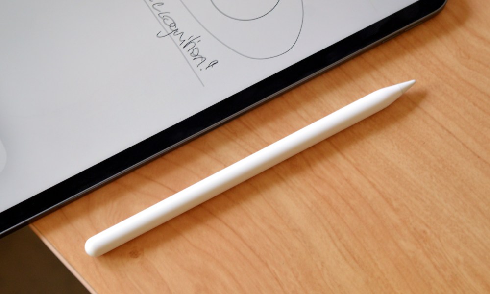 The second-generation Apple Pencil beside an iPad.