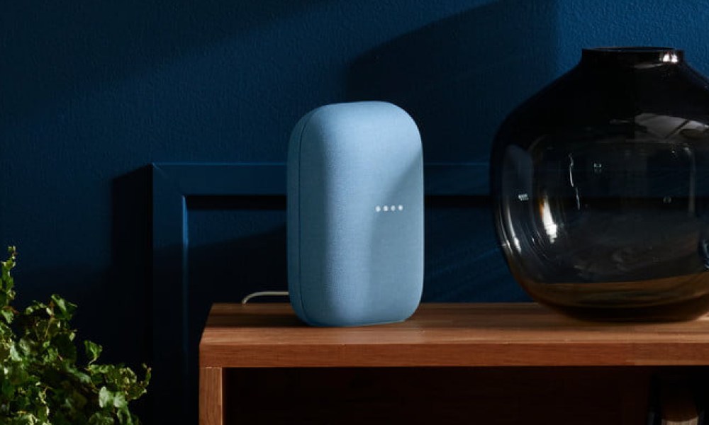 The Google Nest Audio speaker on a table.