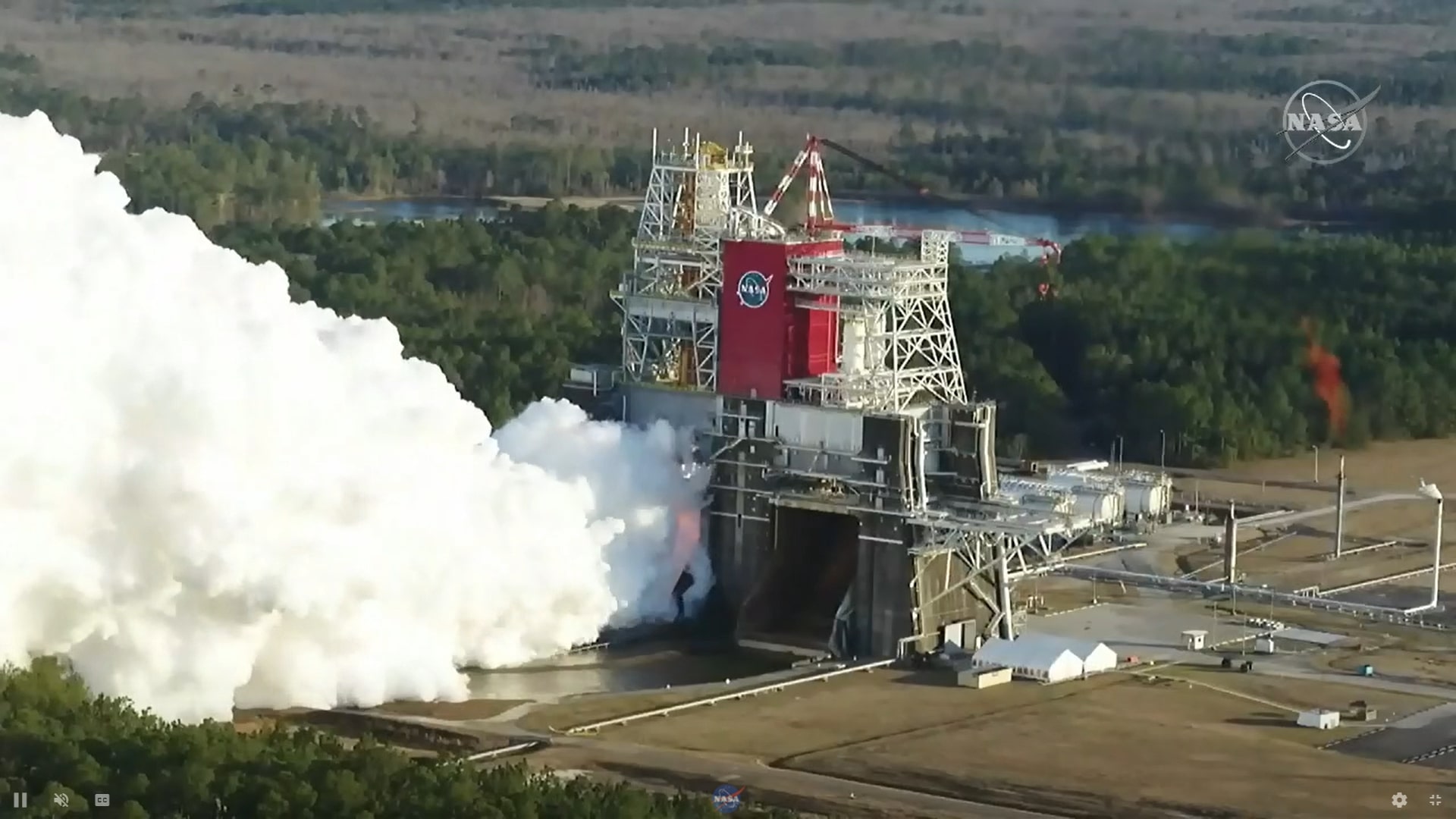 The core stage for the first flight of NASA’s Space Launch System rocket is seen in the B-2 Test Stand during a hot fire test Jan. 16, 2021, at NASA’s Stennis Space Center near Bay St. Louis, Mississippi.