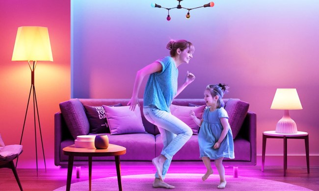 Mother and daughter dancing in living room with Govee smart lights on.