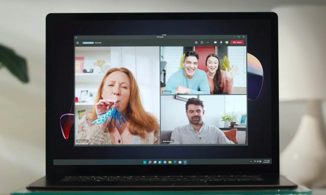 A video call in Microsoft Teams is displayed on a laptop.