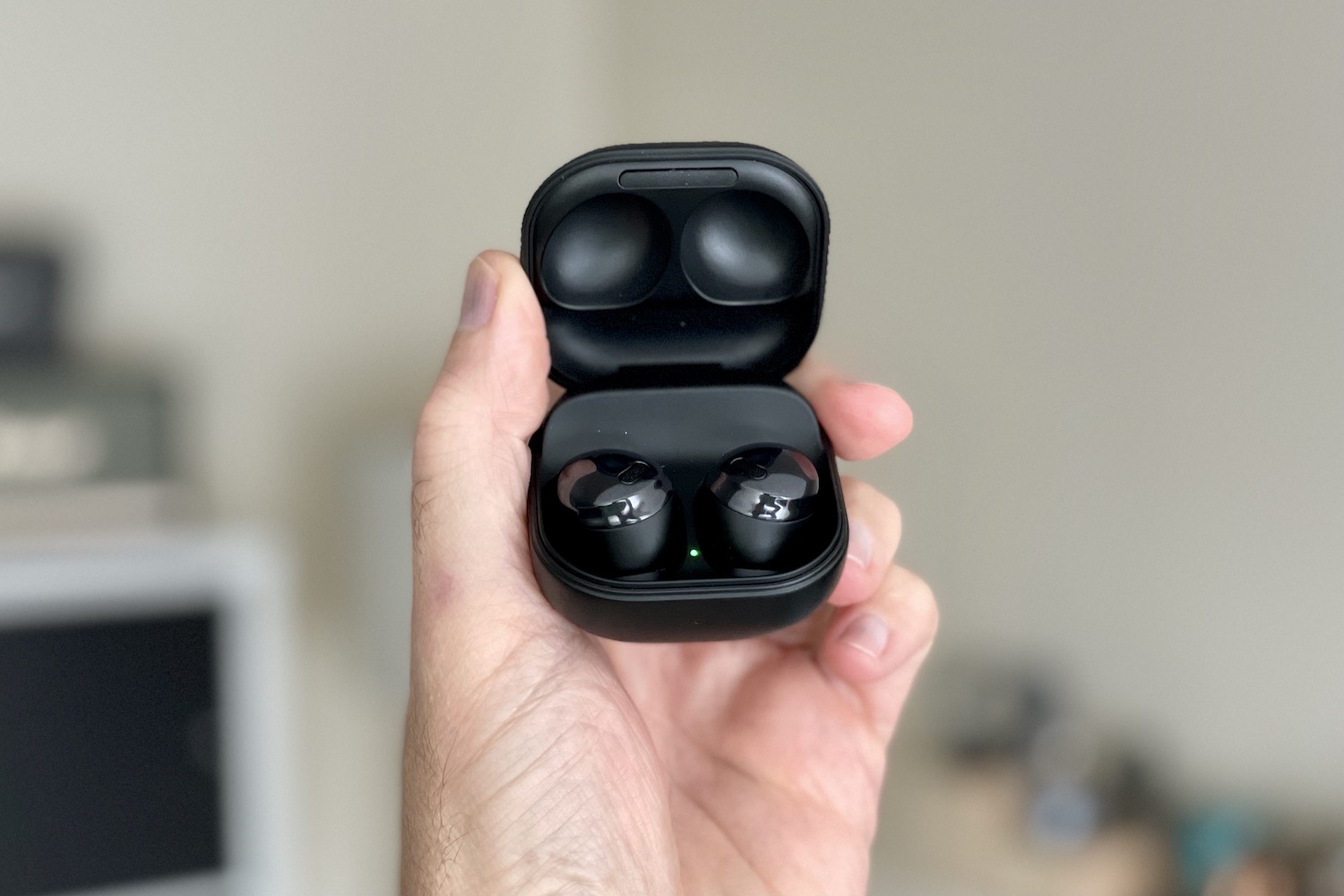 Samsung Galaxy Buds Pro headphones in open case.