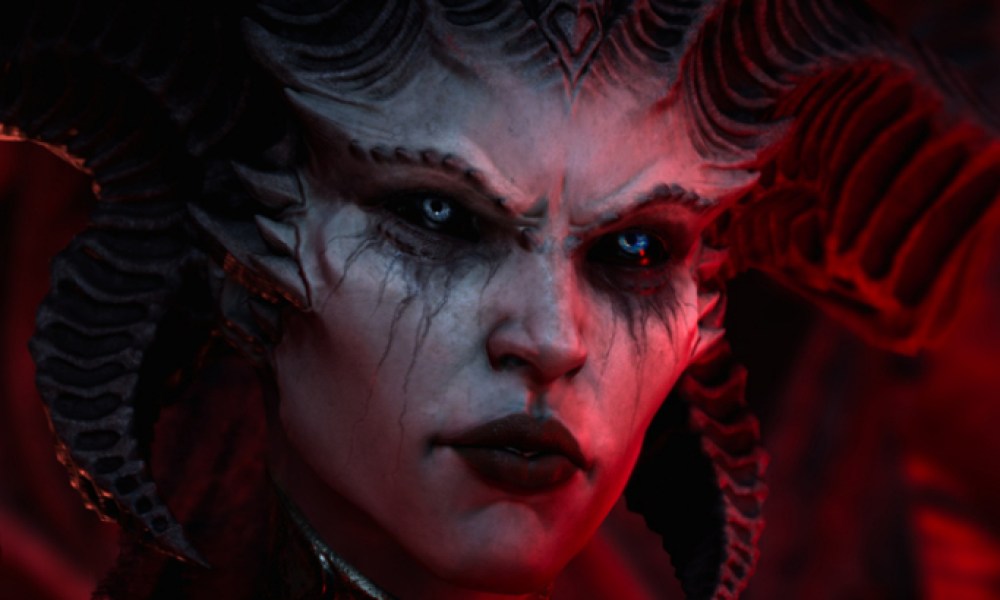 Diablo 4 promotional image of Lillith. It's a close-up shot and she's bathed in red light.