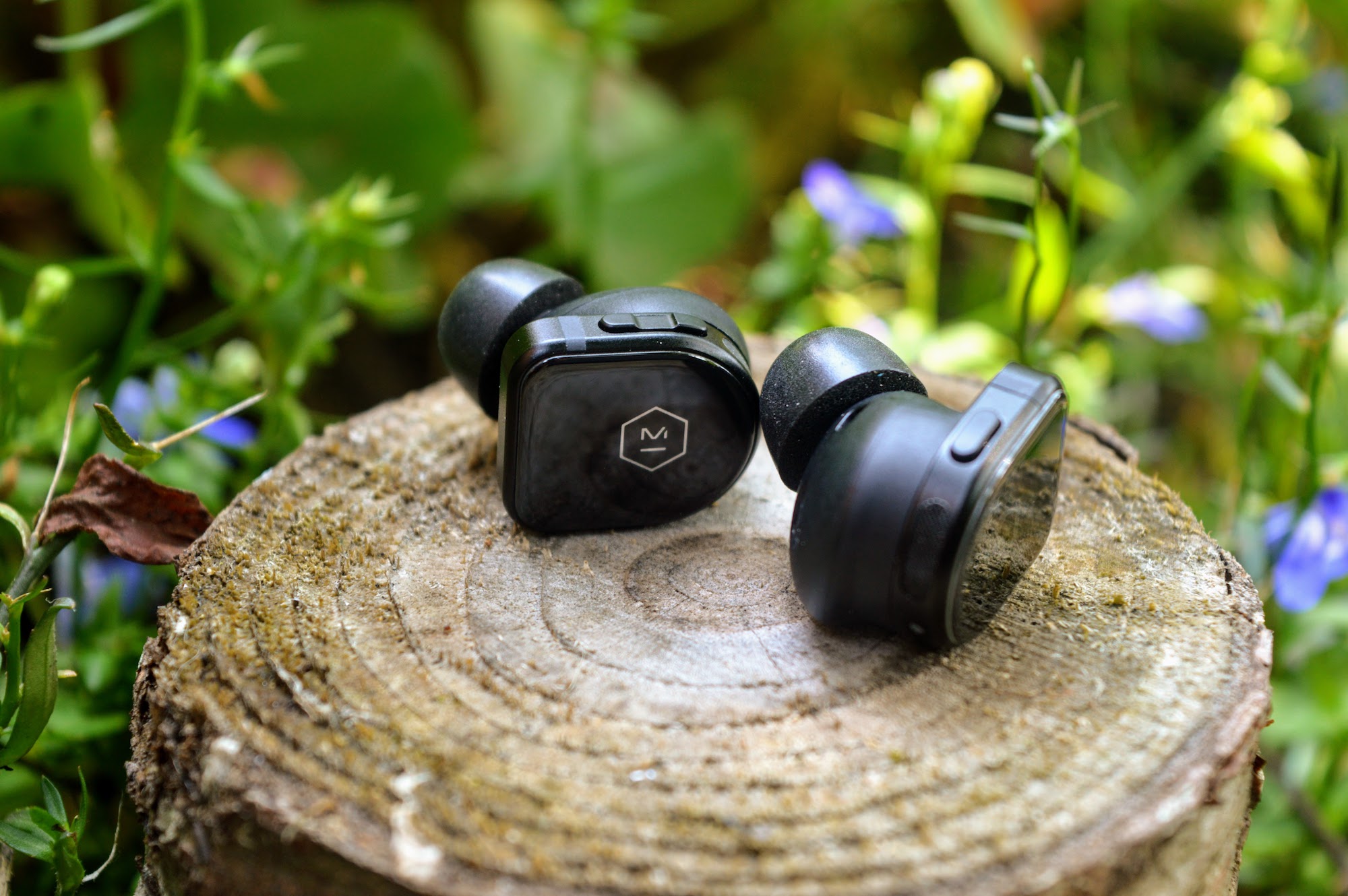 Master & Dynamic MW08 Sport true wireless earbuds close-up.