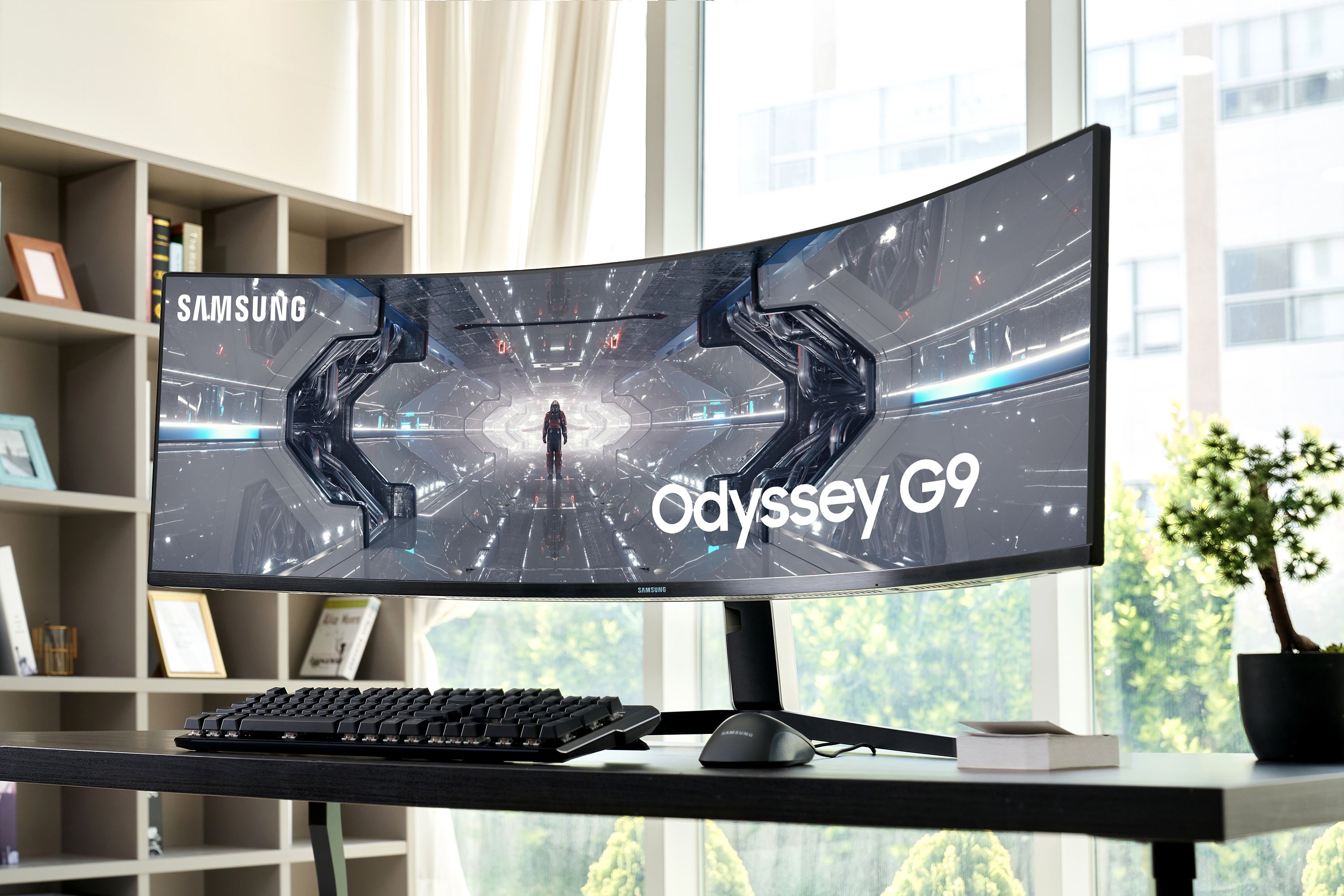 Front view of Samsung's new QLED Odyssey gaming monitor sitting on desk.