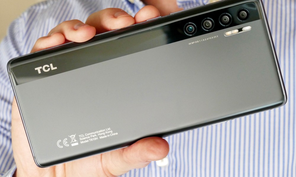 The TCL 20 Pro 5G seen from the back, held in hand.