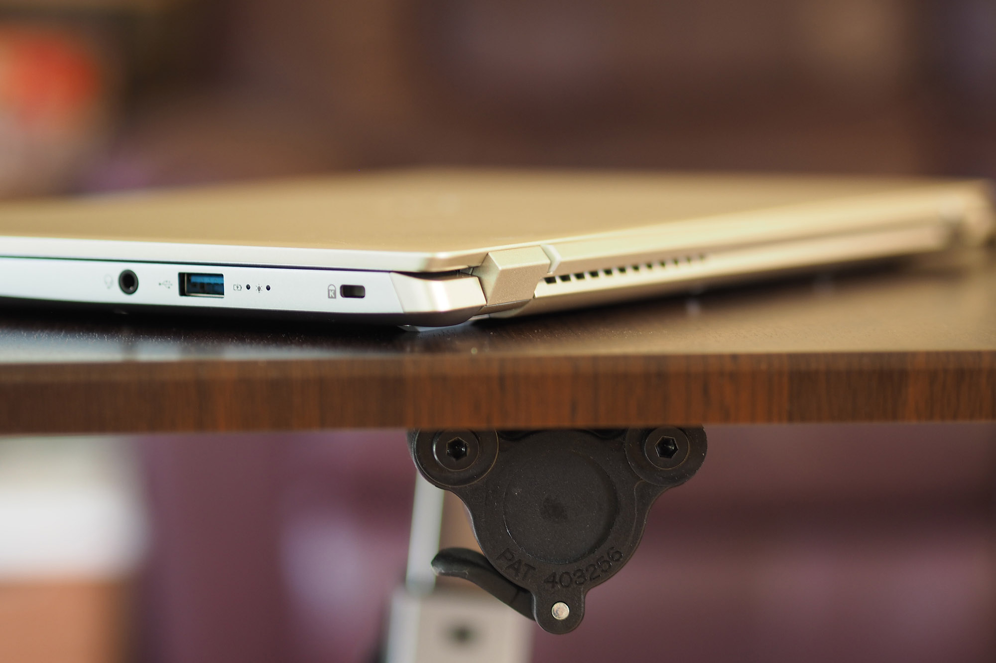 Closed Acer Swift X laptop sitting on a desk.