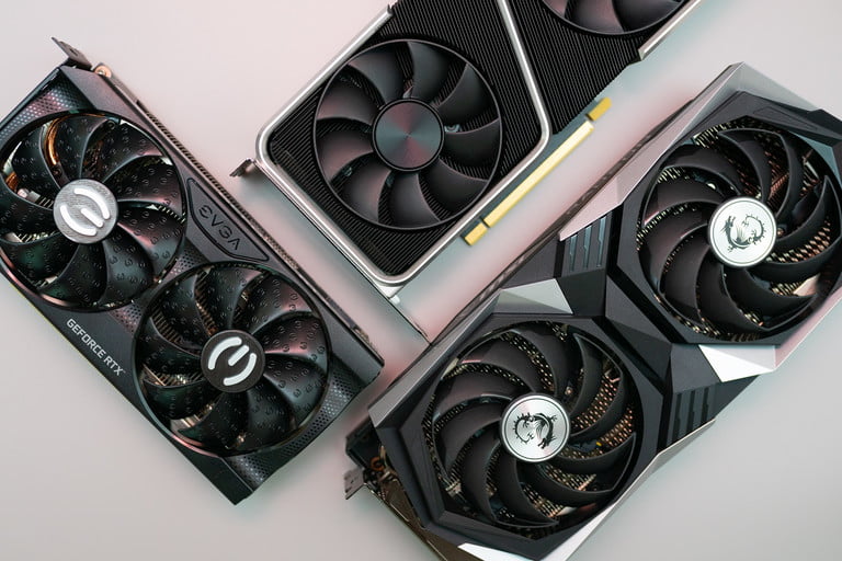 Three graphics cards on a gray background.