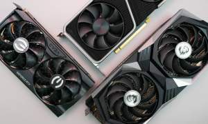 Three graphics cards on a gray background.