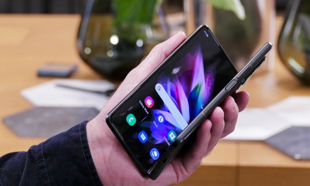 Galaxy Z Fold 3 almost closed in hand.