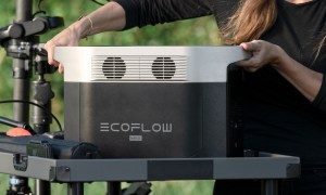 Woman adding EcoFlow Delta Max power station to stand.