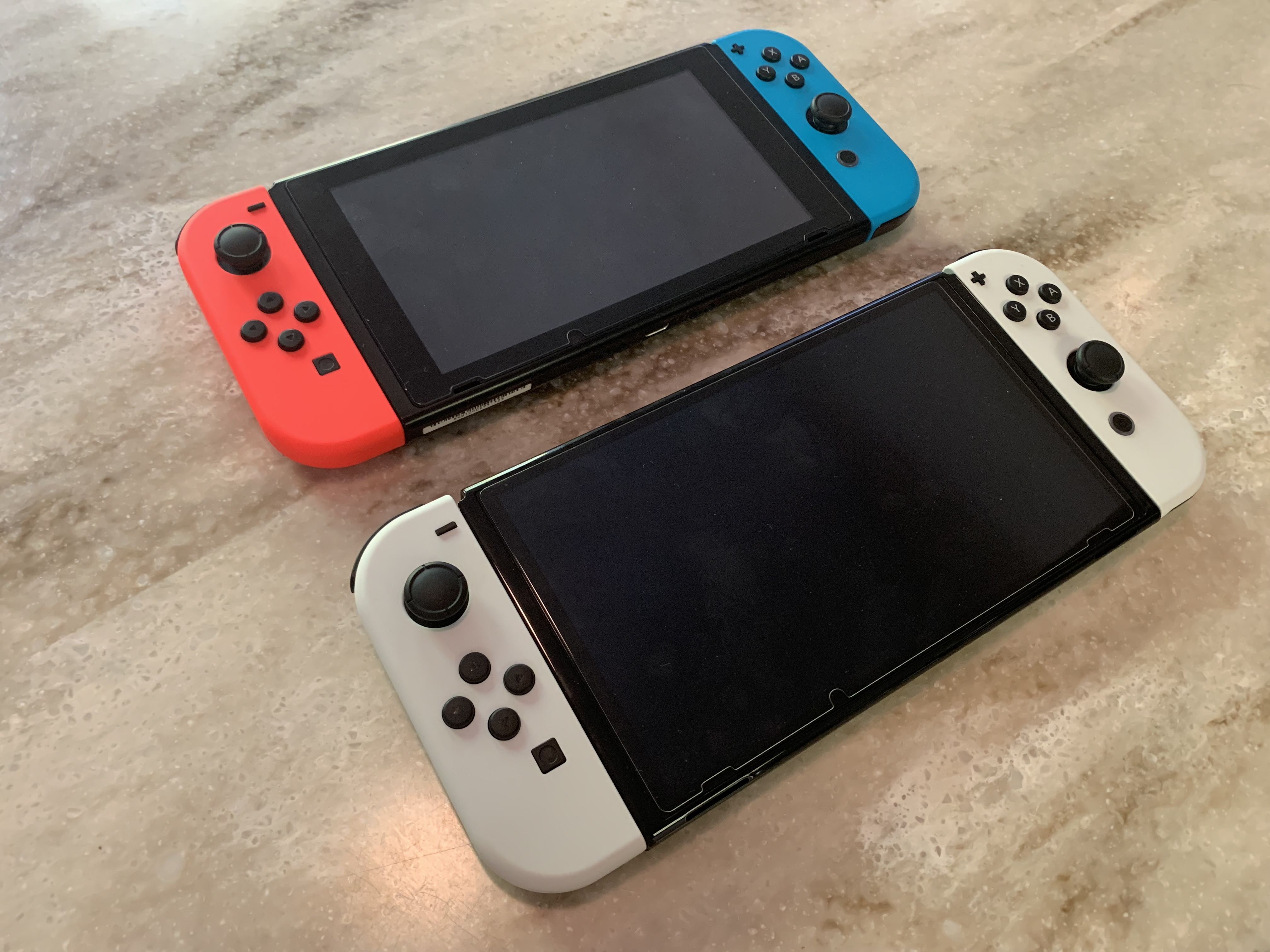 Original Switch next to Switch OLED.