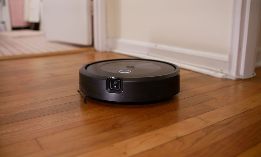 iRobot Roomba j7+ on hardwood floor.