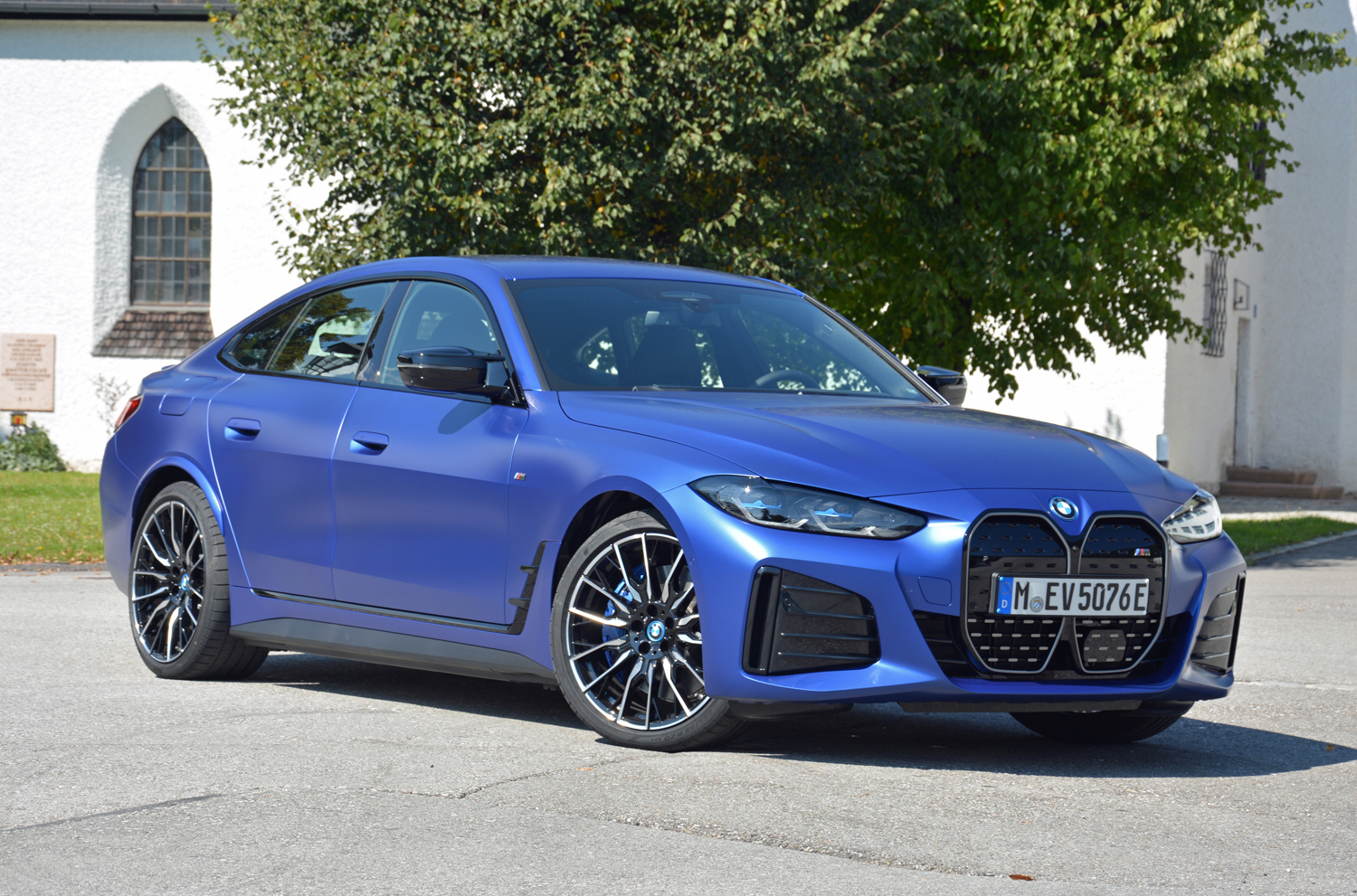 A 2022 BMW i4 M50 in a driveway.