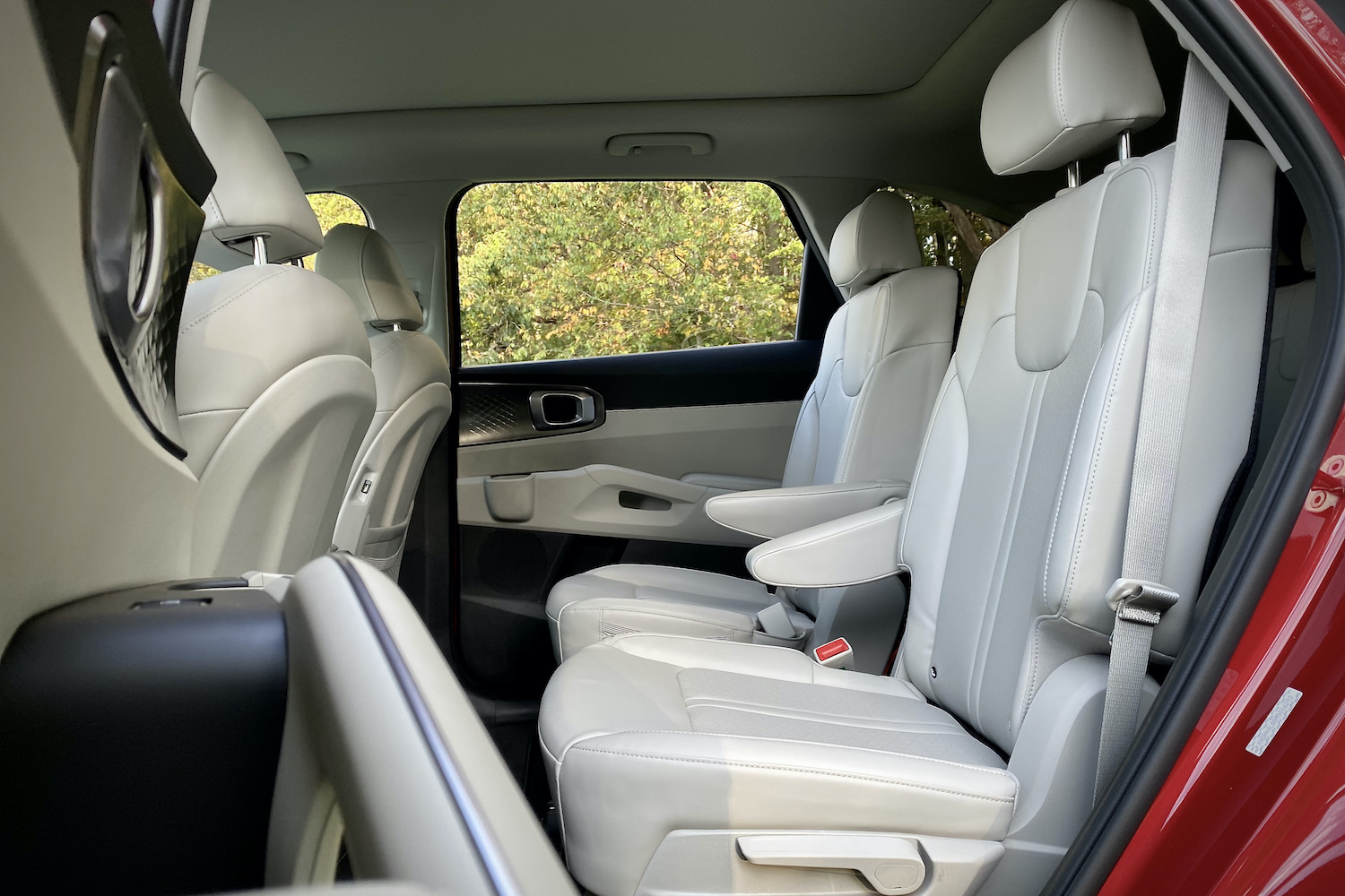 Second-row seats in the 2021 Kia Sorento Hybrid with trees in the background.