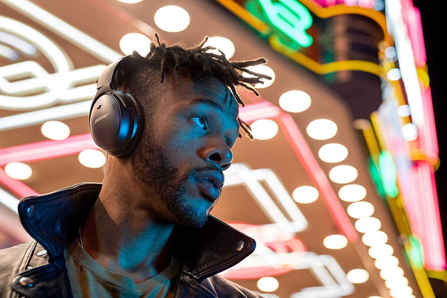 Man wearing Bose QuietComfort 45 Wireless Noise Cancelling Headphones.