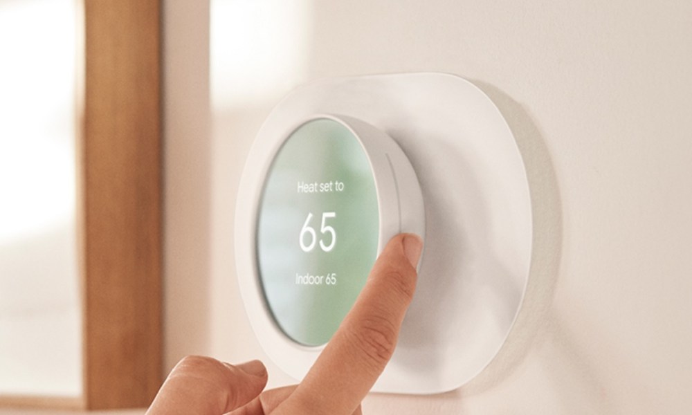 Adjusting the temperature on the Google Nest Thermostat.