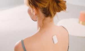 Upright go being worn using adhesive on the back.