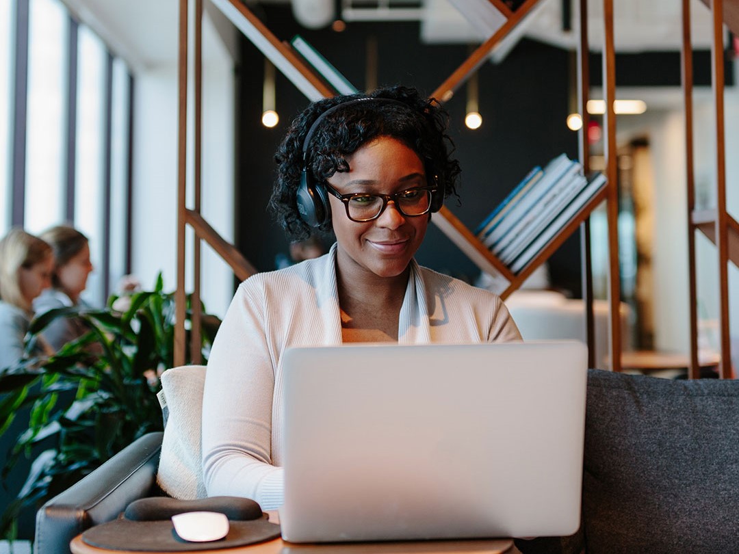 industrious dedicated workspaces you need december 2021 woman working in shared workspace