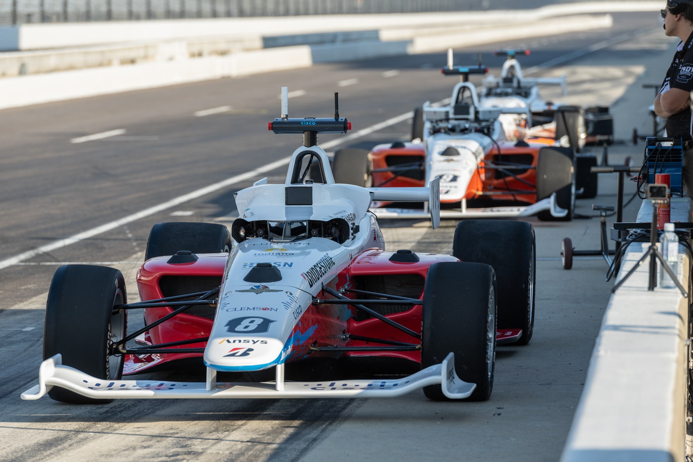 Autonomous race cars lined up.