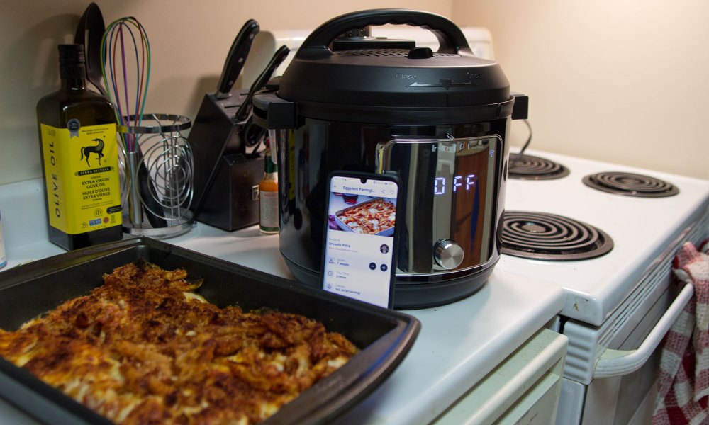 Instant Pot Pro Plus with casserole dish in foreground.