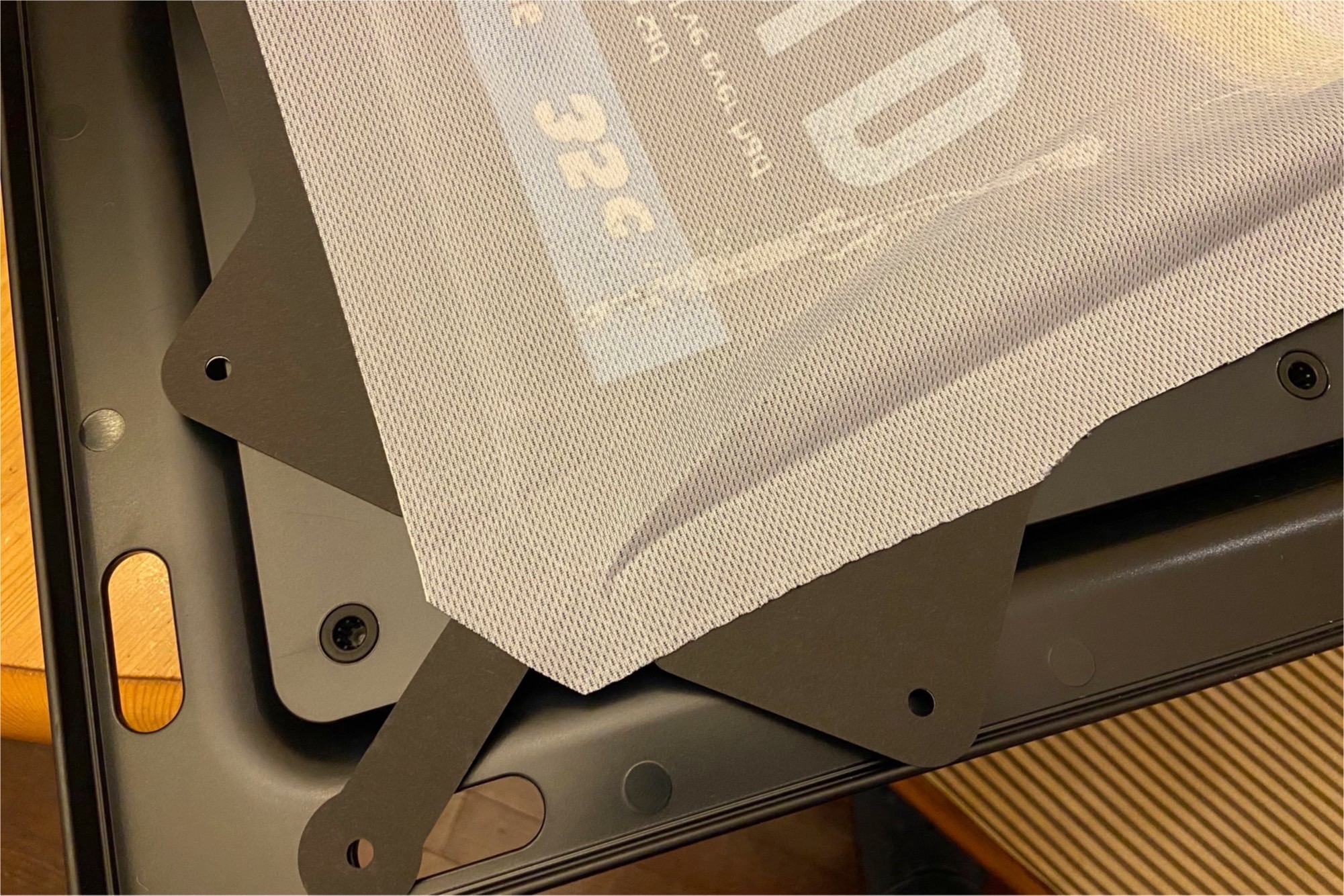 Close-up of the mounting tabs on a custom cover for the Ikea Symfonisk Picture Frame speaker.