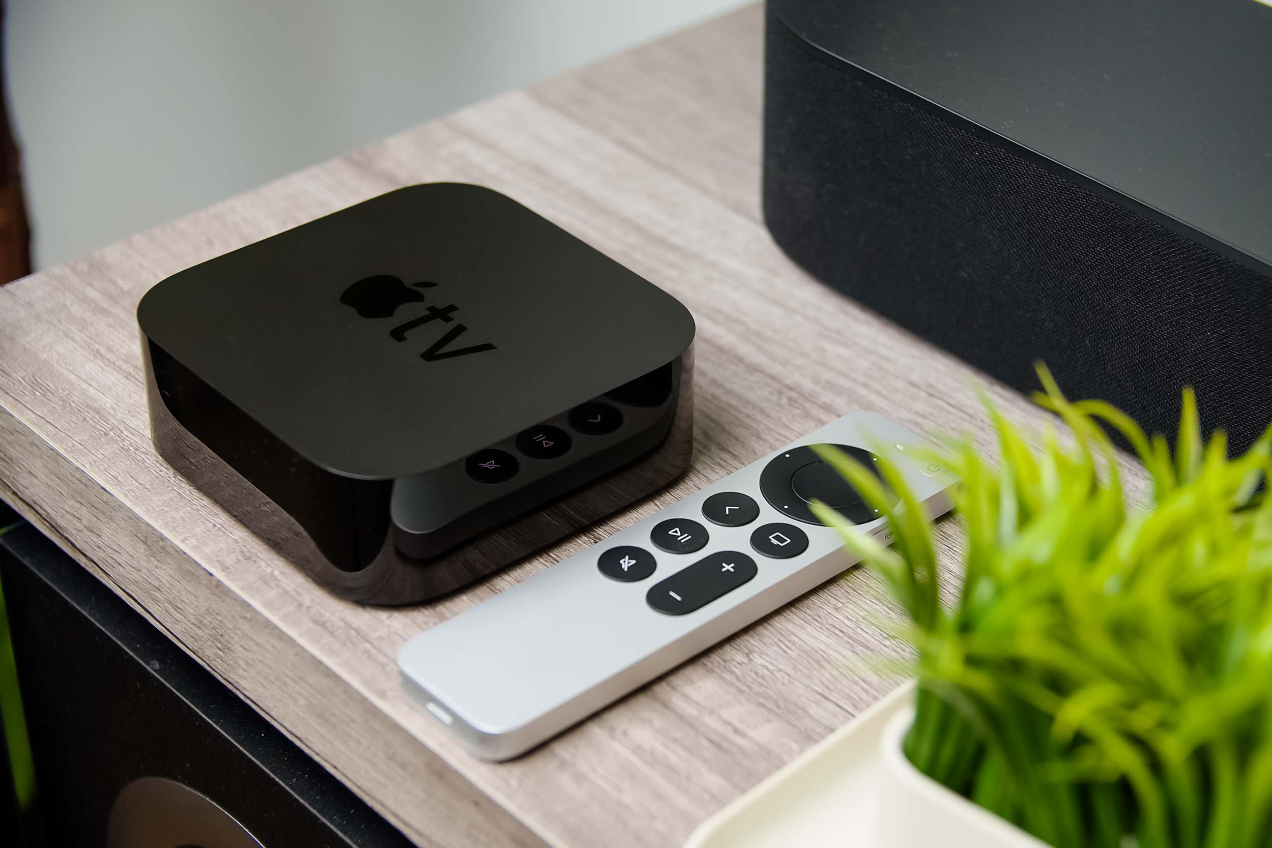 An Apple TV 4K sits on a media stand.