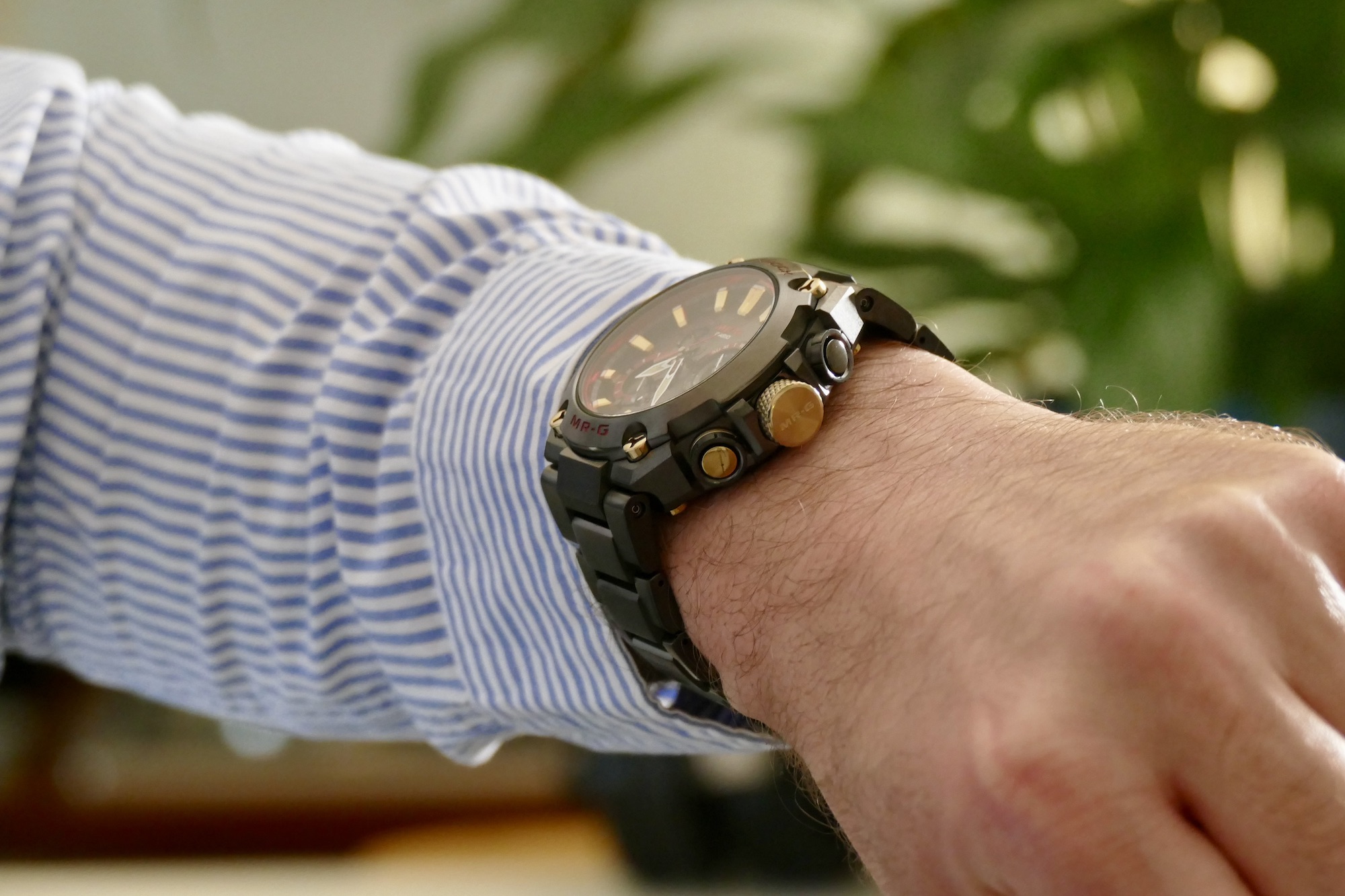 The G-Shock MRG-B2000B on the wrist showing the gold crown.