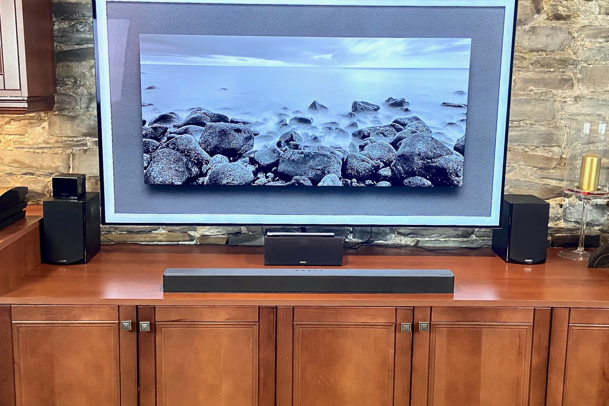 Vizio M-Series 2.1 soundbar below a 65-inch TV.